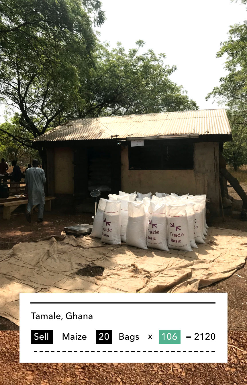 20 large bags of grain sit outside a small building in Ghana